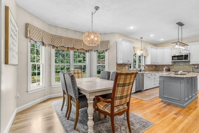 14 Glen Rd, Hopkinton, MA 01748 - dining space featuring a chandelier, healthy amount of natural light, light wood-style floors, and recessed lighting