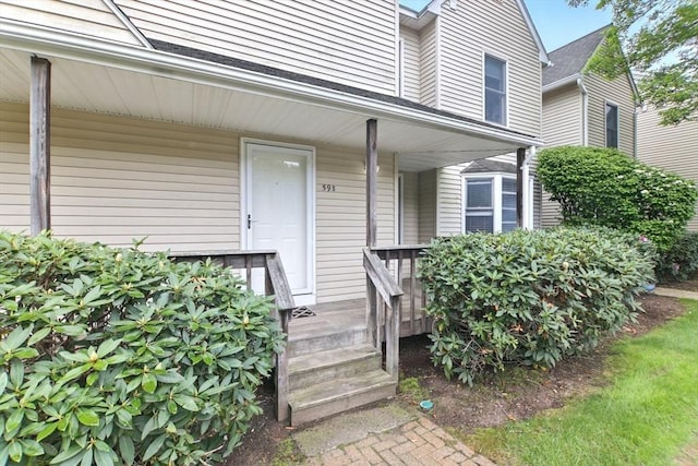 59 Castlegate Dr Unit B, Springfield, MA 01129 - entrance to property featuring a porch and roof with shingles