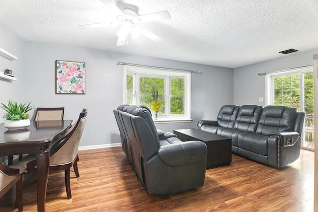 59 Castlegate Dr Unit B, Springfield, MA 01129 - living room featuring a textured ceiling, wood finished floors, and ceiling fan