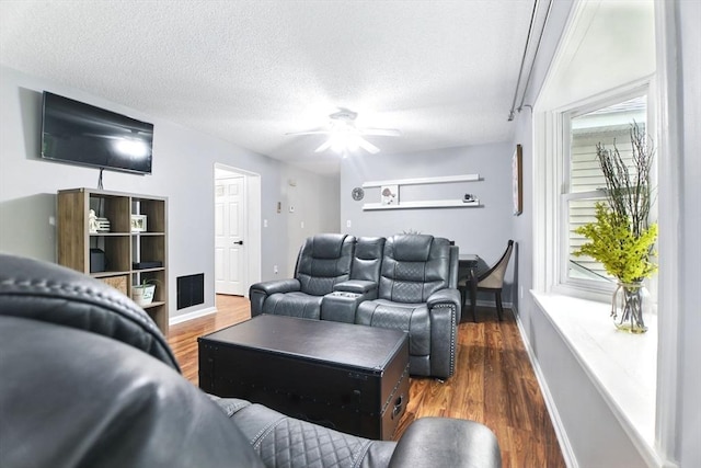 59 Castlegate Dr Unit B, Springfield, MA 01129 - living room featuring baseboards, a ceiling fan, a textured ceiling, and wood finished floors