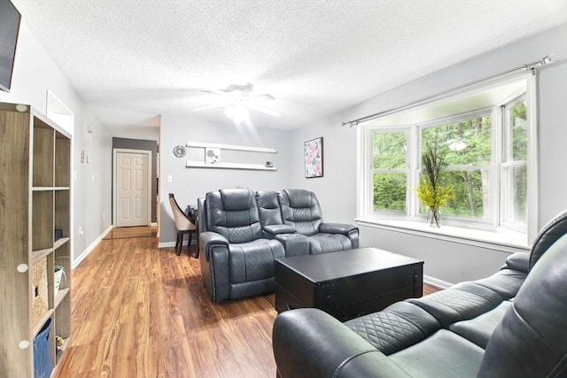 59 Castlegate Dr Unit B, Springfield, MA 01129 - living room featuring wood finished floors, ceiling fan, a textured ceiling, and baseboards