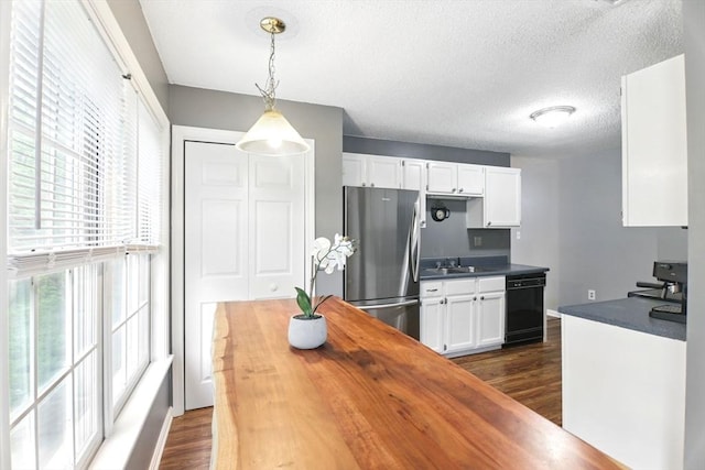 59 Castlegate Dr Unit B, Springfield, MA 01129 - kitchen featuring freestanding refrigerator, butcher block countertops, black dishwasher, dark wood finished floors, and white cabinetry