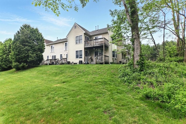 59 Castlegate Dr Unit B, Springfield, MA 01129 - rear view of house featuring a yard, a balcony, and a wooden deck