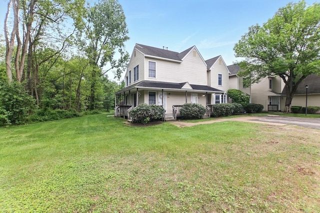 59 Castlegate Dr Unit B, Springfield, MA 01129 - view of front facade with a front yard and covered porch
