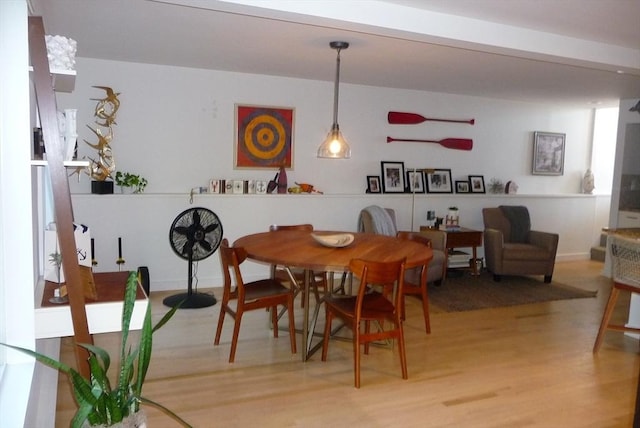 dining space with light wood-type flooring