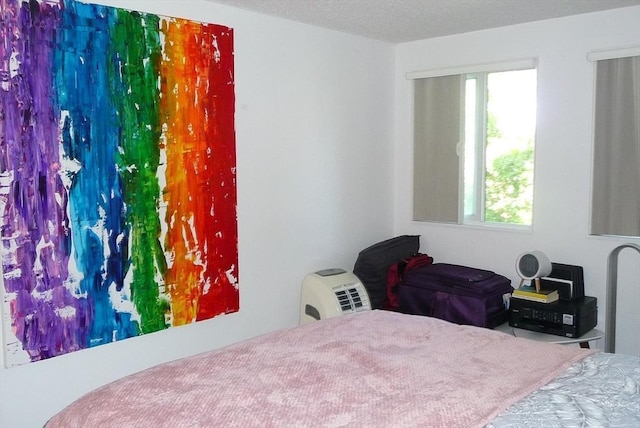 bedroom featuring a textured ceiling