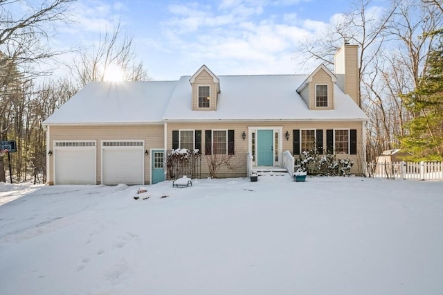 cape cod home featuring fence, a chimney, and an attached garage