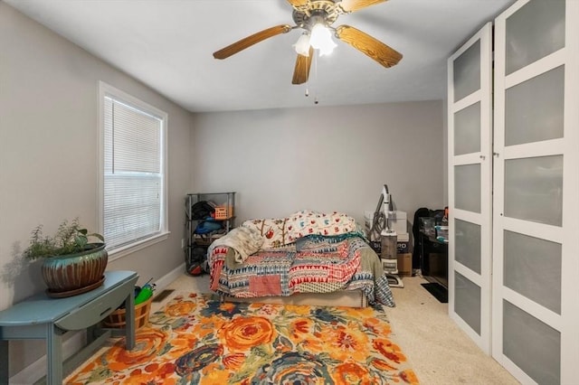 carpeted bedroom featuring a ceiling fan