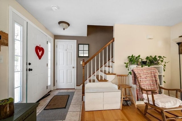 entryway featuring wood finished floors and stairway