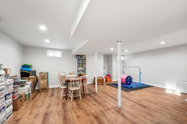 interior space featuring baseboards, light wood-style flooring, and recessed lighting