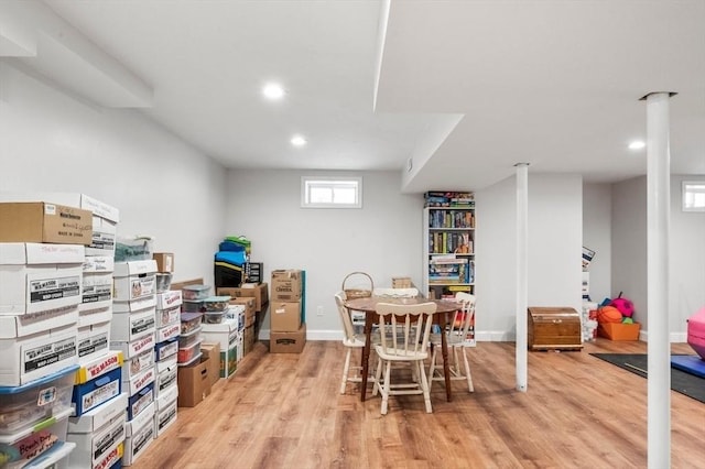 dining room with baseboards, light wood-style flooring, and recessed lighting