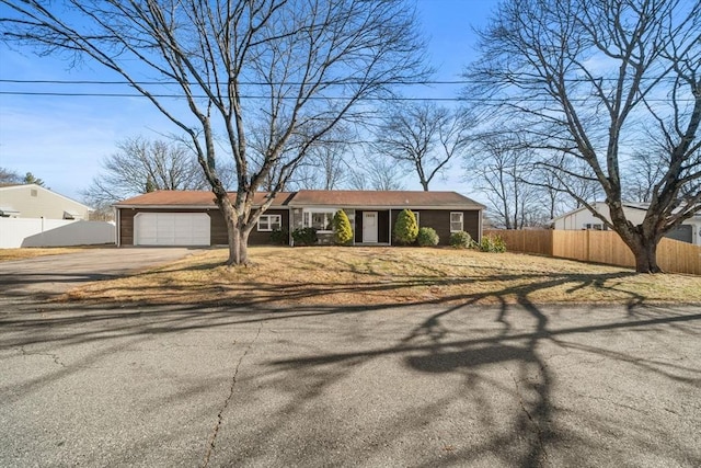 ranch-style house featuring a garage