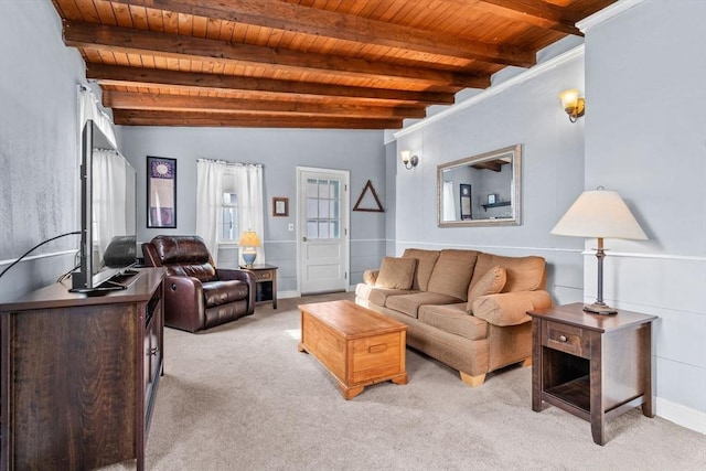 living room with beamed ceiling, light carpet, and wooden ceiling