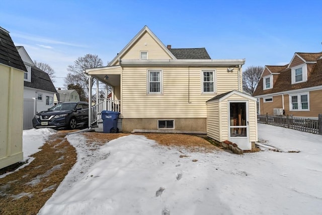 view of snow covered house