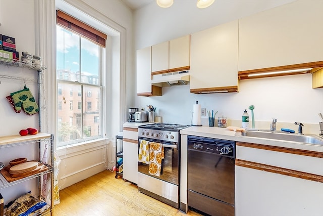 kitchen with light wood-type flooring, dishwasher, stainless steel range with gas stovetop, and sink