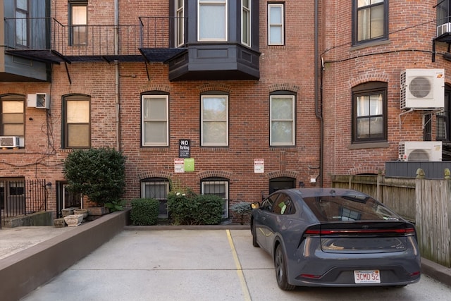 view of building exterior with ac unit and cooling unit