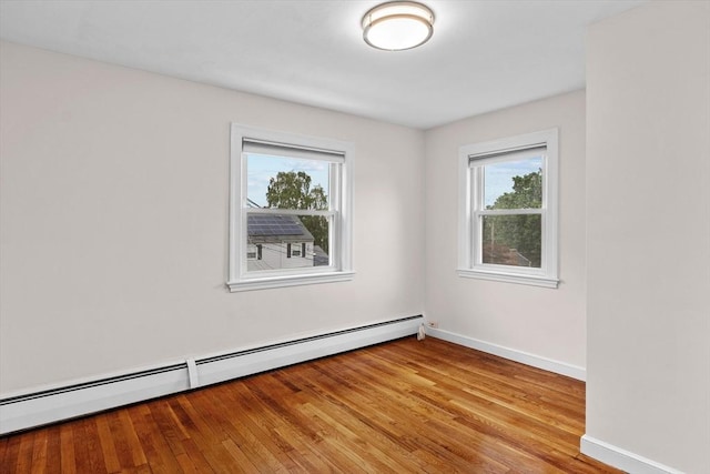 10 Highfield Ter, Boston, MA 02131 - unfurnished room featuring baseboard heating and wood finished floors