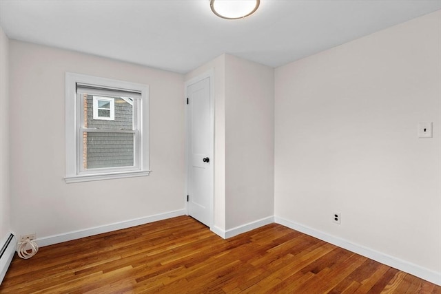 10 Highfield Ter, Boston, MA 02131 - spare room with wood finished floors and a baseboard radiator