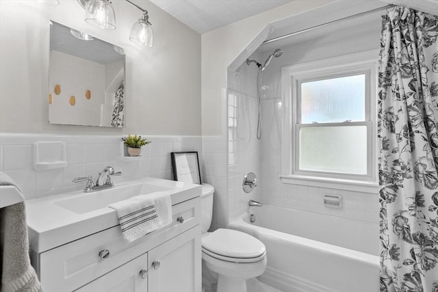 10 Highfield Ter, Boston, MA 02131 - full bathroom featuring vanity, shower / tub combo with curtain, tile walls, and wainscoting