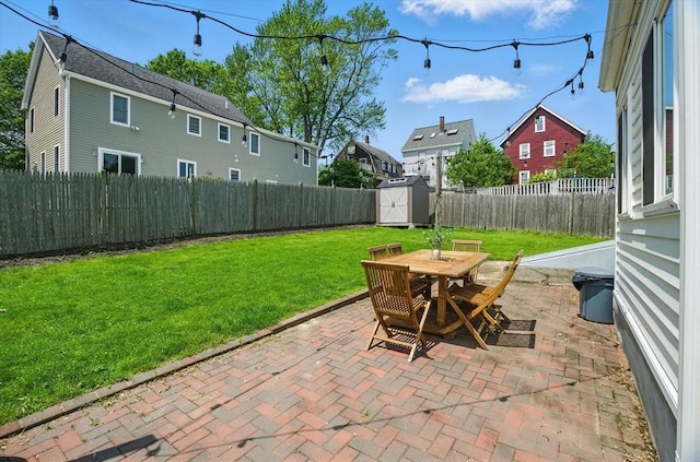 10 Highfield Ter, Boston, MA 02131 - fenced backyard featuring a patio area, a storage shed, outdoor dining area, and a residential view