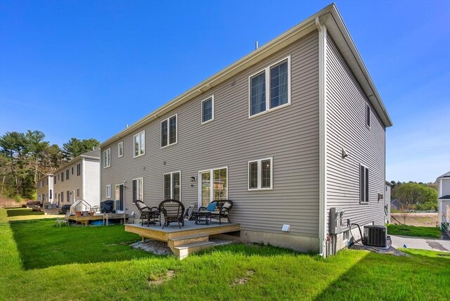 back of house featuring a yard, cooling unit, and a deck