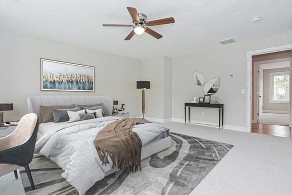 bedroom with ceiling fan and carpet flooring