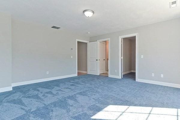 unfurnished bedroom featuring carpet flooring