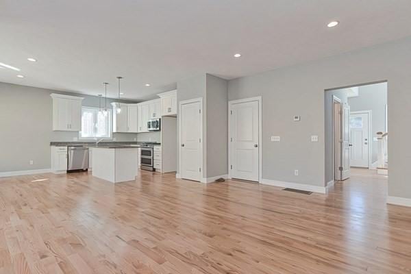 unfurnished living room featuring light wood-type flooring