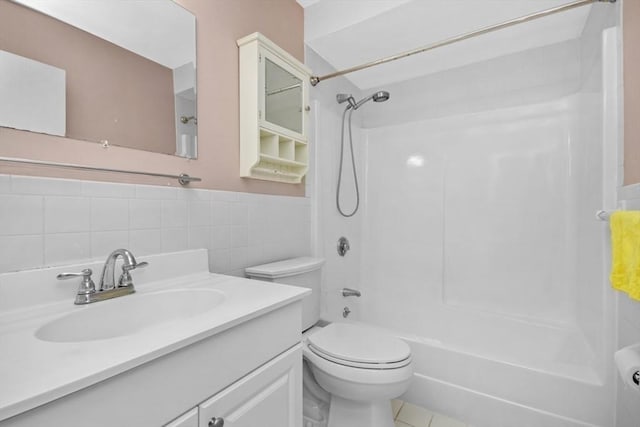 360 Neponset St Unit 503, Canton, MA 02021 - bathroom featuring tile walls, shower / tub combination, toilet, vanity, and wainscoting