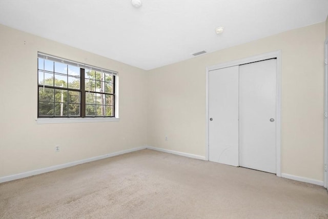 360 Neponset St Unit 503, Canton, MA 02021 - unfurnished bedroom with carpet, baseboards, and a closet