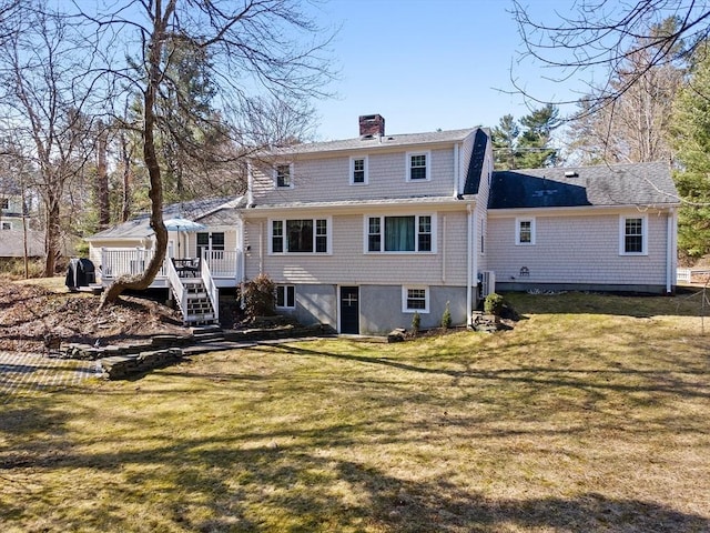 back of house featuring stairs, a wooden deck, a lawn, and a chimney