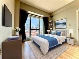 bedroom with light hardwood / wood-style flooring