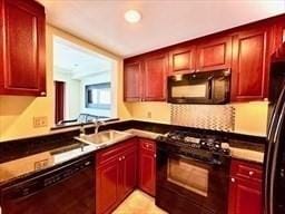 kitchen with sink and black appliances