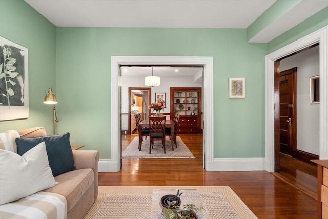 living room with wood finished floors and baseboards