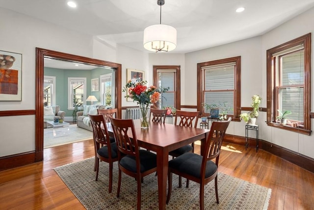 dining space featuring recessed lighting, baseboards, and wood finished floors