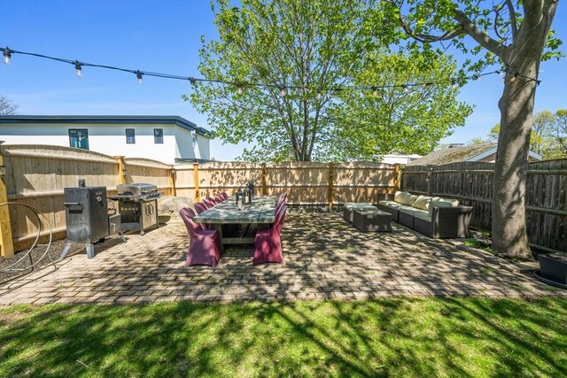 view of yard with a patio, a fenced backyard, and an outdoor hangout area