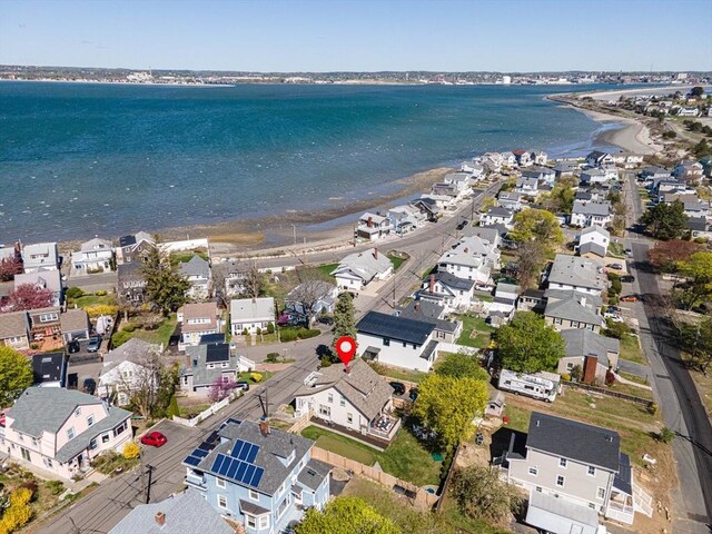 aerial view featuring a water view, a residential view, and a view of the beach