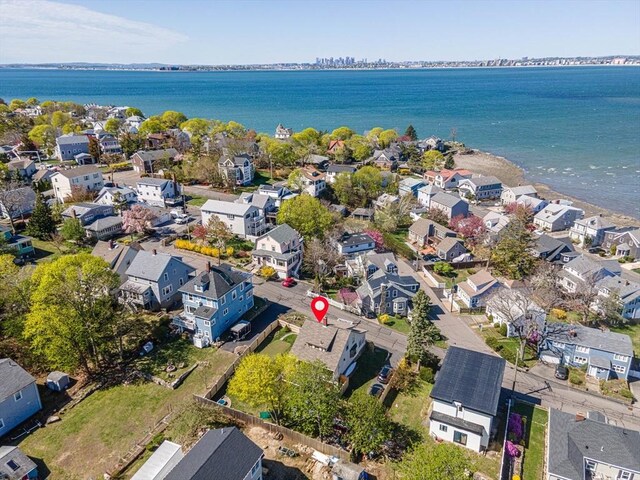 birds eye view of property with a water view and a residential view