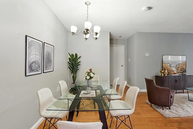 49 Village Brook Ln Unit 2, Natick, MA 01760 - dining space featuring a chandelier and wood finished floors