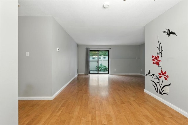49 Village Brook Ln Unit 2, Natick, MA 01760 - empty room with light wood-style floors and a smoke detector