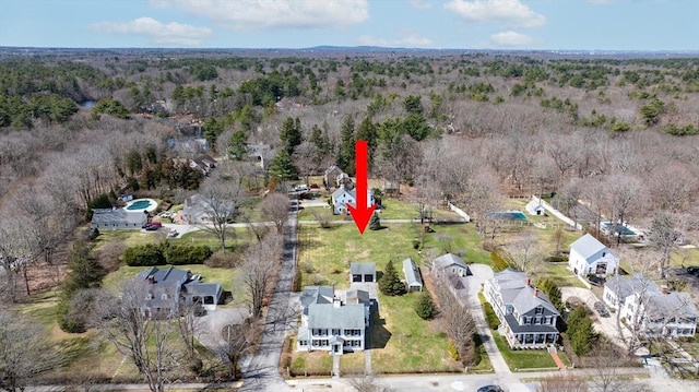 aerial view featuring a residential view and a view of trees