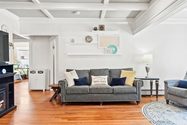 living room with crown molding, baseboard heating, light wood finished floors, beamed ceiling, and coffered ceiling