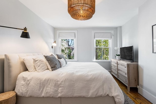 bedroom featuring dark wood-type flooring