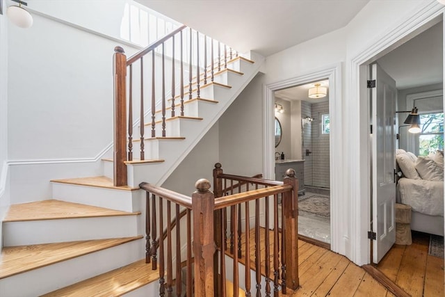 stairway featuring hardwood / wood-style floors