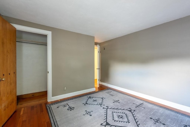 22 Sherman Ave, Northampton, MA 01060 - unfurnished bedroom with hardwood / wood-style floors, baseboards, and a closet