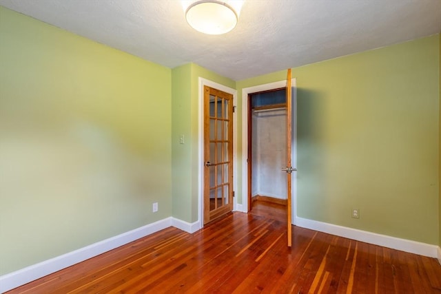 22 Sherman Ave, Northampton, MA 01060 - unfurnished bedroom featuring baseboards, wood-type flooring, and a closet