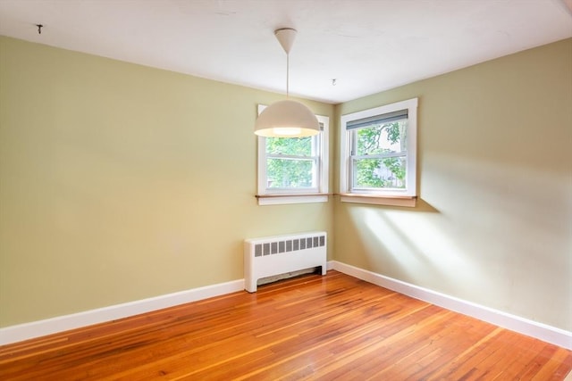 22 Sherman Ave, Northampton, MA 01060 - unfurnished room with radiator heating unit, baseboards, and light wood-style floors