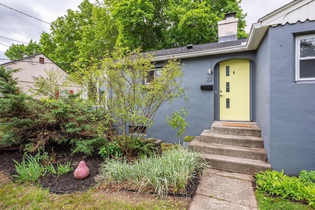 22 Sherman Ave, Northampton, MA 01060 - doorway to property with a chimney and stucco siding