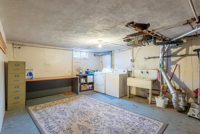 22 Sherman Ave, Northampton, MA 01060 - basement featuring independent washer and dryer, a sink, and a textured ceiling