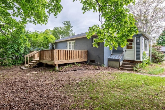 22 Sherman Ave, Northampton, MA 01060 - back of house with a wooden deck and stucco siding